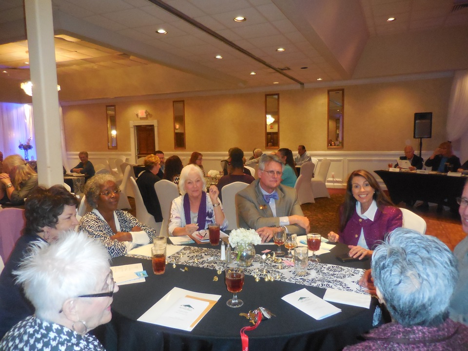 Trustees and others enjoy the meeting.